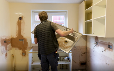 Contractors Removing A Sink