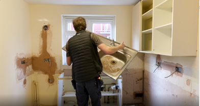 Contractors Removing A Sink